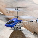 Mini RC helicopter rises over timber